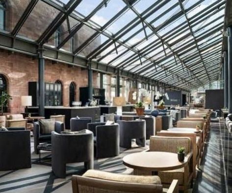 Casino-inspired lounge with elegant card tables and refined atmosphere